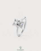 Radiant cut moissanite solitaire engagement ring in 925 silver with a sleek band and sparkling center stone.
