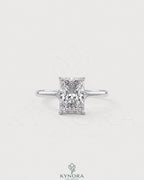 Radiant cut moissanite solitaire engagement ring in 925 silver with a sleek band, showcasing a sparkling central stone.