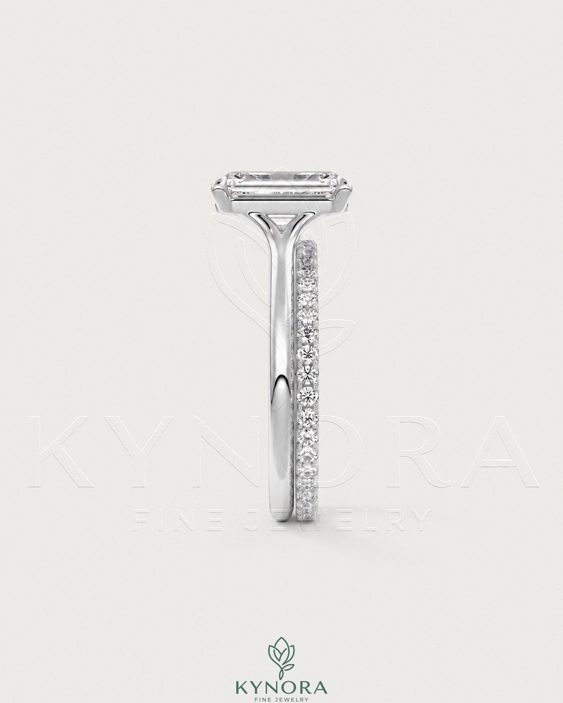 Emerald cut moissanite solitaire engagement ring in 925 sterling silver with a sleek band, by Kynora CJ.