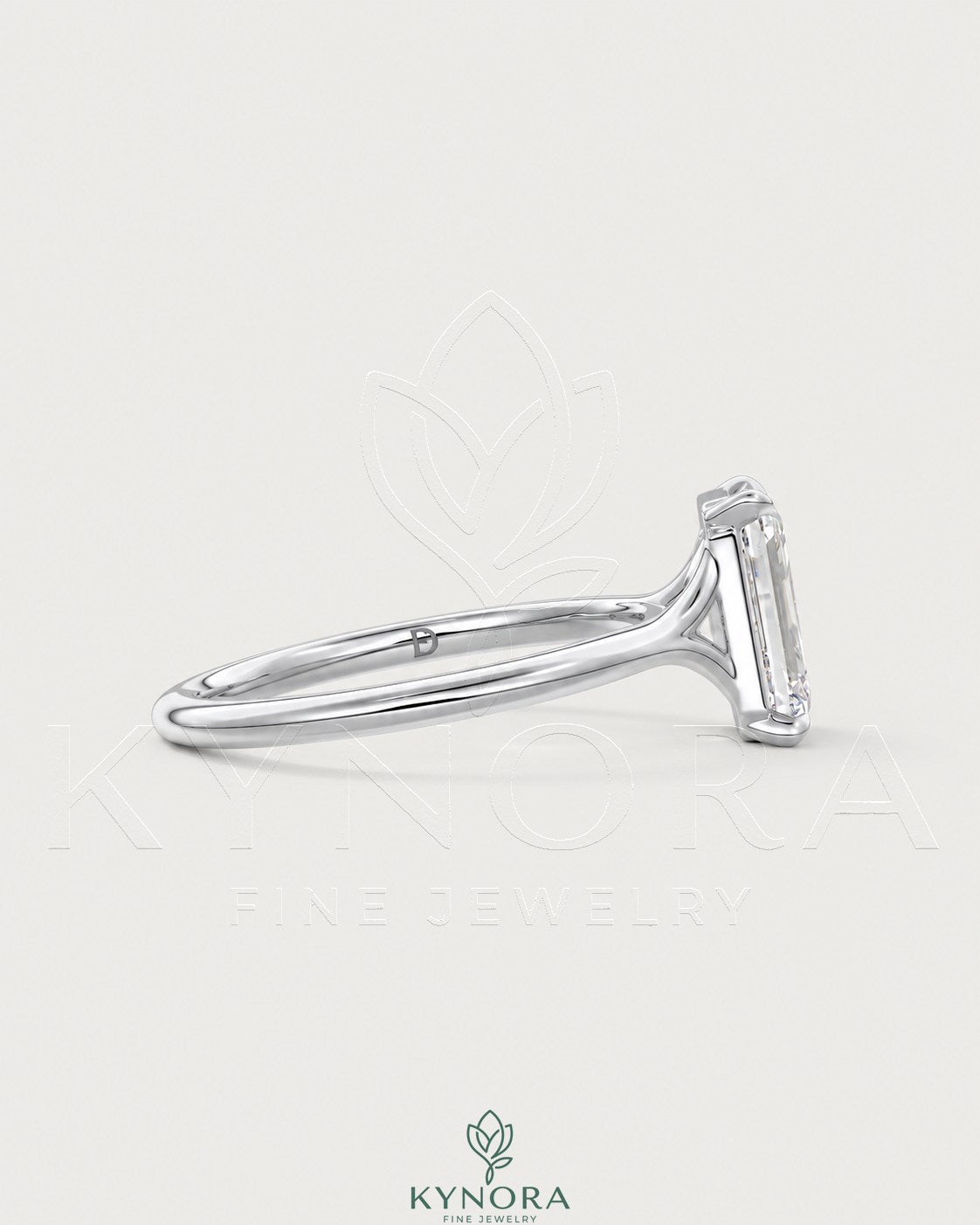 Emerald cut moissanite solitaire engagement ring in 925 sterling silver with a sleek band, showcasing elegant jewelry craftsmanship.
