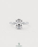 Oval cut moissanite solitaire engagement ring in 925 sterling silver with a sleek band and sparkling center stone.
