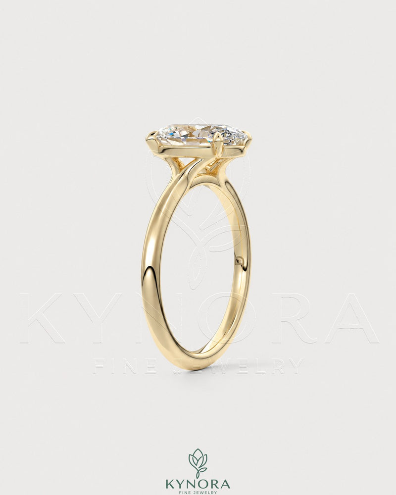 Oval cut moissanite solitaire engagement ring in 925 sterling silver with a sleek band and sparkling center stone.