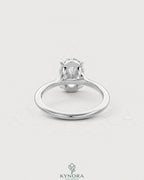 Oval cut moissanite solitaire engagement ring in sterling silver with a sleek band, showcasing elegant jewelry craftsmanship.
