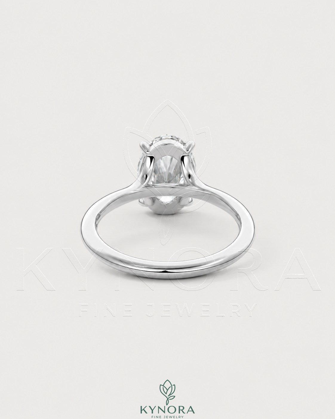 Oval cut moissanite solitaire engagement ring in sterling silver with a sleek band, showcasing elegant jewelry craftsmanship.