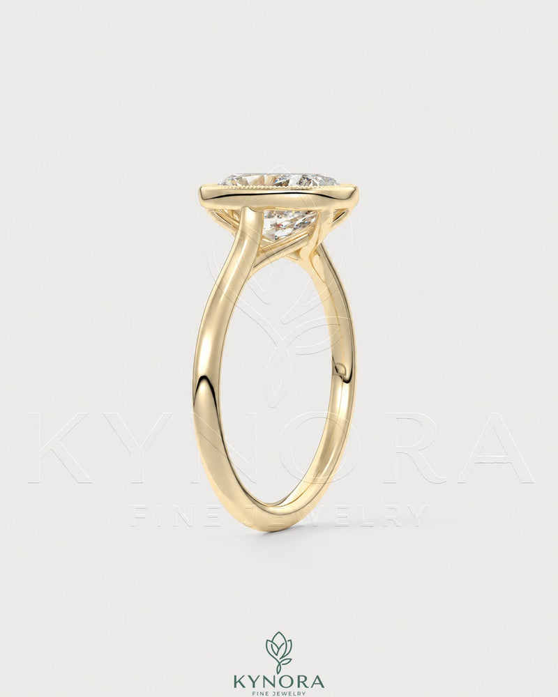 Vintage milgrain bezel cushion moissanite engagement ring in 925 silver with intricate details, designed by Kynora CJ.