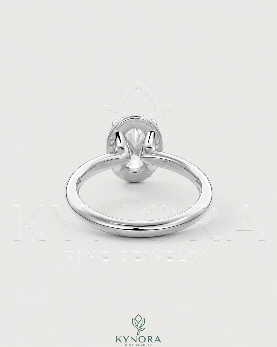 Oval moissanite bezel solitaire engagement ring in 925 silver with a sleek, elegant setting by Kynora CJ.
