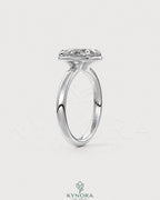 Oval moissanite bezel solitaire engagement ring in 925 silver with a sleek, elegant design from Kynora CJ.