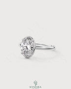 Oval moissanite bezel solitaire engagement ring in 925 silver with a sleek, modern design from Kynora CJ.