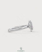 Oval moissanite bezel solitaire engagement ring in 925 silver with a sleek, modern design by Kynora CJ.
