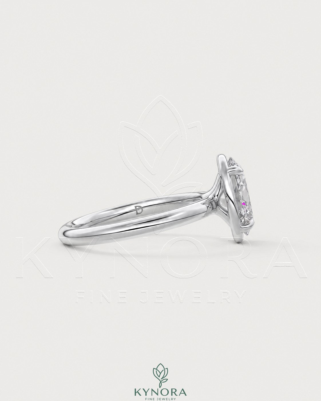Oval moissanite bezel solitaire engagement ring in 925 silver with a sleek, modern design by Kynora CJ.