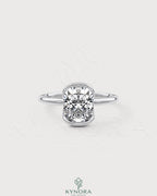 Elongated silver bezel ring with a moissanite half-bezel solitaire, showcasing a sleek and elegant design.