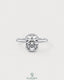 Elongated silver bezel ring with a moissanite half-bezel solitaire, showcasing a sleek and elegant design.