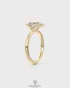 Elongated Moissanite half-bezel solitaire ring in 925 silver, featuring a sleek design and sparkling gemstone from Kynora CJ.