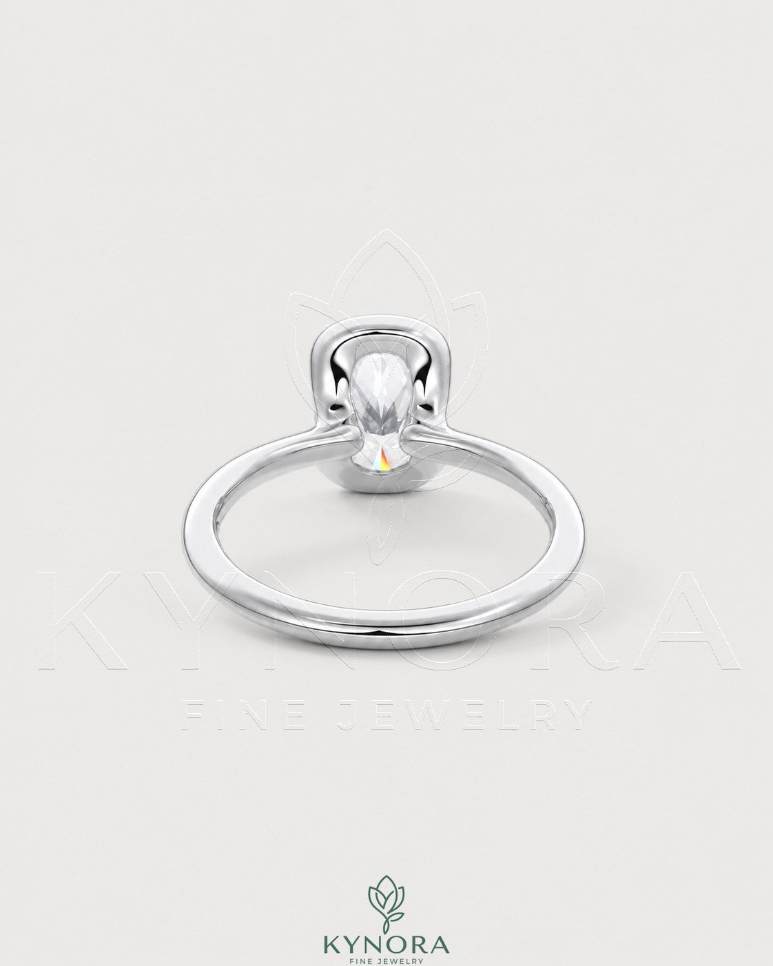 Elongated silver bezel solitaire ring with moissanite stone, crafted in 925 silver by Kynora CJ.