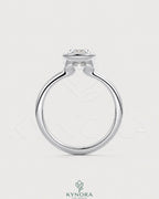 Elongated moissanite half-bezel solitaire ring in 925 silver with a sleek design, featuring a sparkling elongated gemstone setting.