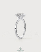 Elongated bezel solitaire ring with moissanite gemstone in 925 silver, featuring a sleek half-bezel design by Kynora CJ.