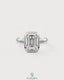 Emerald cut moissanite bezel engagement ring in 925 silver with a sleek band, designed by Kynora CJ.