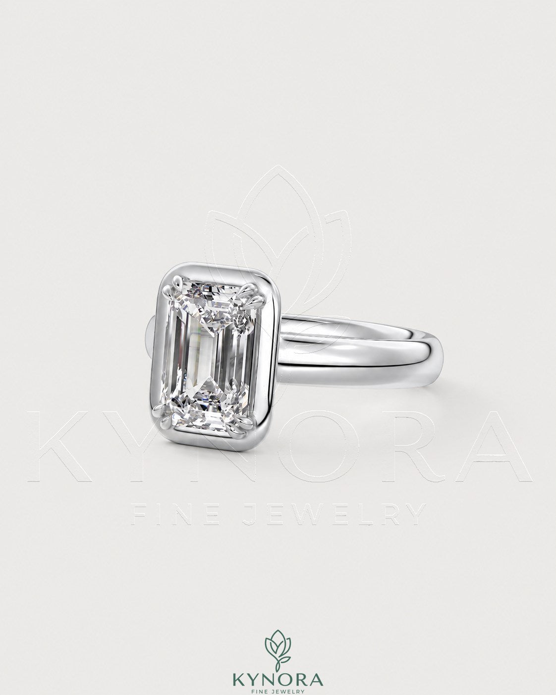 Emerald cut moissanite bezel engagement ring in 925 silver with a sleek, modern design by Kynora CJ.