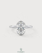 Oval moissanite half-bezel solitaire engagement ring in 925 silver with a sleek, elegant design.