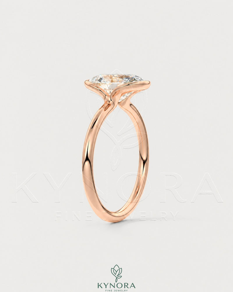 Oval moissanite half-bezel solitaire engagement ring in 925 silver, showcasing a sleek, elegant design with a central gemstone.