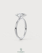 Oval moissanite half-bezel solitaire engagement ring in 925 silver with detailed craftsmanship and elegant design.