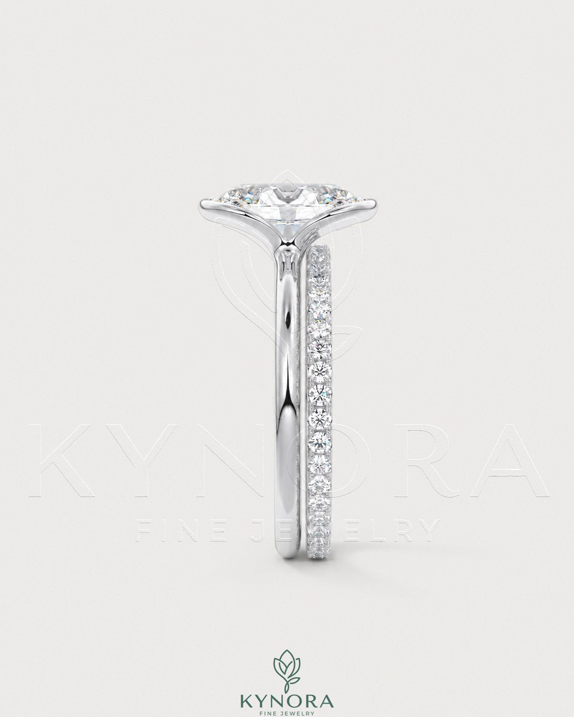 Oval moissanite half-bezel solitaire engagement ring in 925 silver with a sleek, modern design by Kynora CJ.