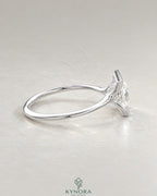Princess cut moissanite half-bezel solitaire ring in 925 silver with a sleek band, showcasing elegant jewelry craftsmanship.