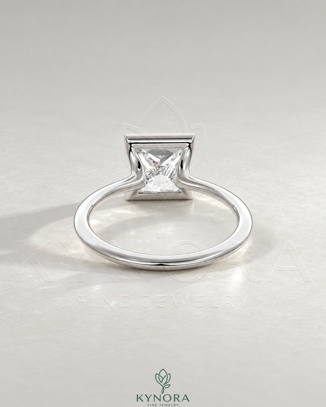 Princess cut moissanite half-bezel solitaire ring in 925 silver with a sleek band, featuring a sparkling center stone.