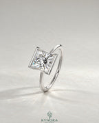 Princess cut moissanite half-bezel solitaire ring in 925 silver featuring a sparkling gemstone set in a sleek bezel design.