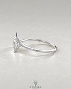 Princess cut moissanite half-bezel solitaire ring in 925 silver with a sleek design, featuring a sparkling center gemstone.