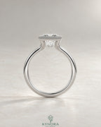 Princess cut moissanite half-bezel solitaire ring in 925 silver with a sleek band, featuring a sparkling center stone.