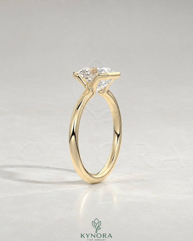 Asscher cut moissanite half-bezel solitaire ring in 925 silver with a sleek band, featuring a sparkling center stone.
