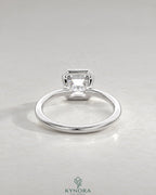 Asscher cut moissanite half-bezel solitaire ring in 925 silver with a sleek, modern design by Kynora CJ.
