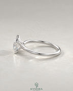 Asscher cut moissanite half-bezel solitaire ring in 925 silver with a sleek band and sparkling center stone.