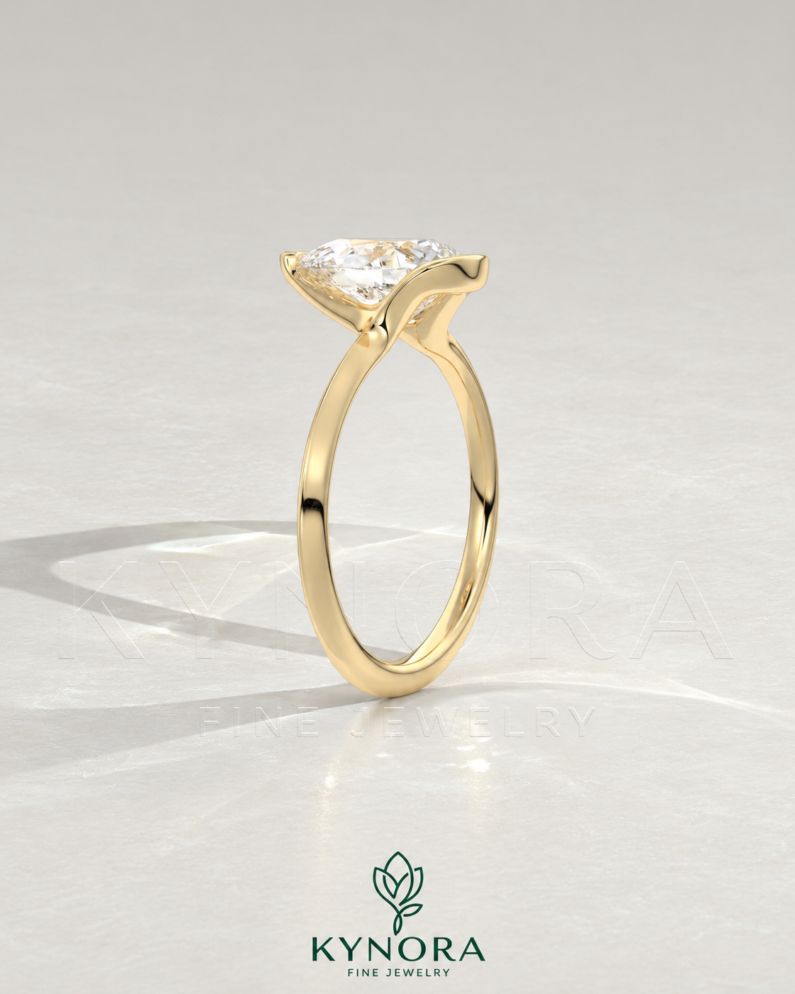 Pear cut moissanite half-bezel engagement ring in 925 silver with a sleek, elegant design displayed on an ivory backdrop.