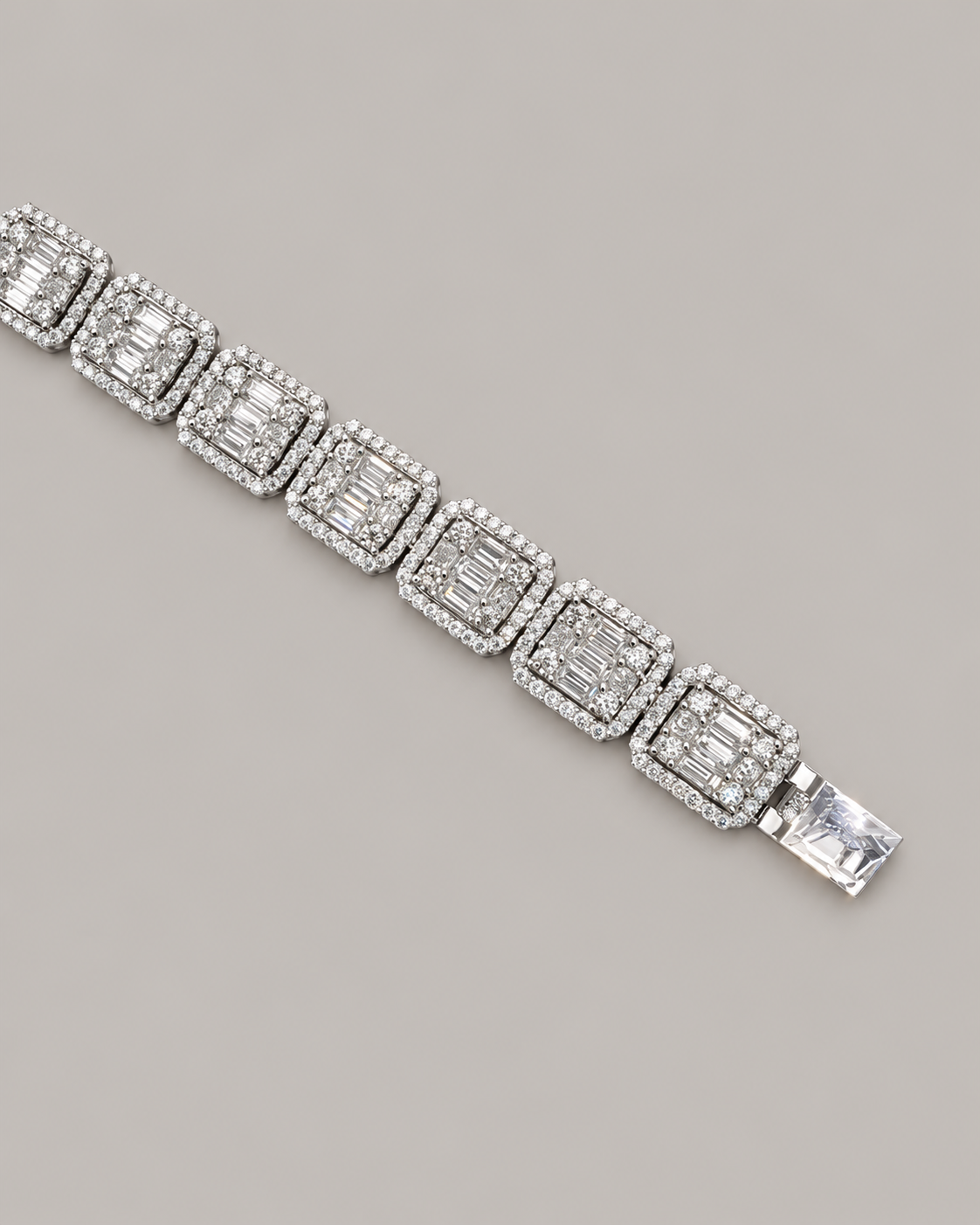 Sterling silver tennis bracelet with baguette stones, worn on white glove, showcasing Kynora Jewels' hip-hop style bracelet.