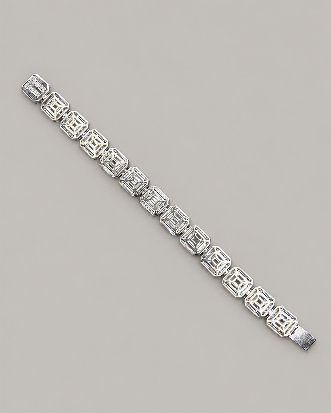 Sterling silver tennis bracelet with baguette diamonds, worn on a white-gloved hand, showcasing Kynora Jewels' hip-hop style jewelry.