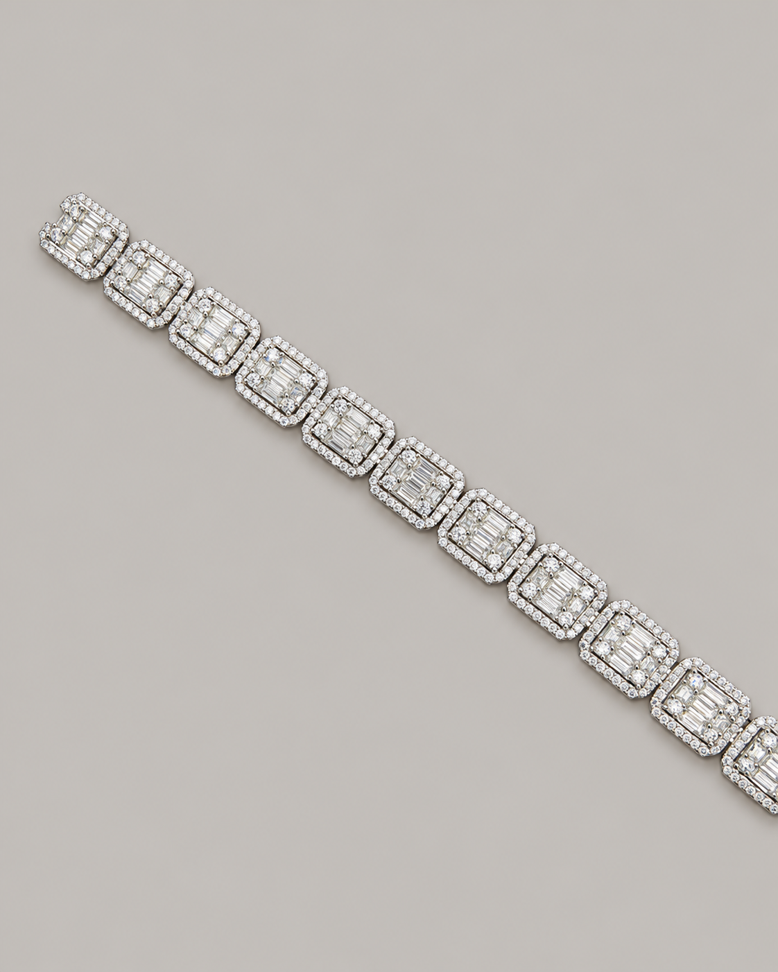 Sterling silver tennis bustdown bracelet by Kynora Jewels, featuring sparkling hip-hop style design, displayed on a white glove.