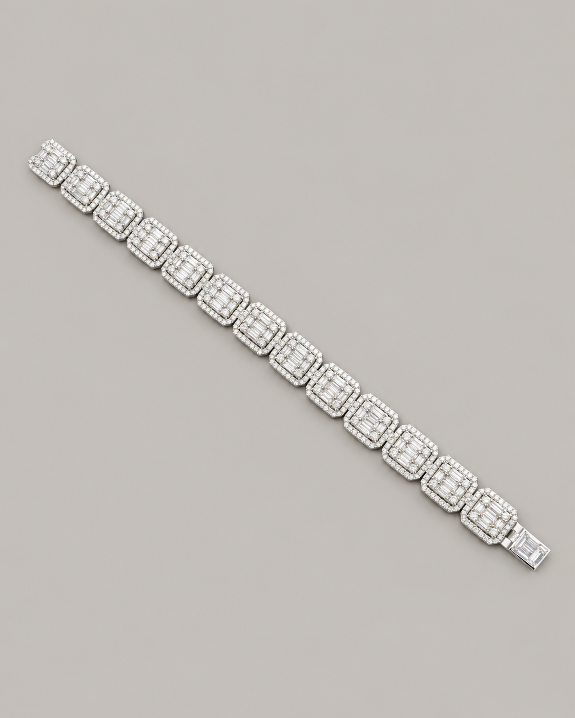 Sterling silver tennis bustdown bracelet by Kynora Jewels featuring sparkling hip-hop style design on neutral background.