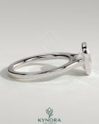 Kynora CJ 2ct elongated cushion bezel solitaire engagement ring with cathedral high setting, showcasing a sparkling diamond and elegant band.