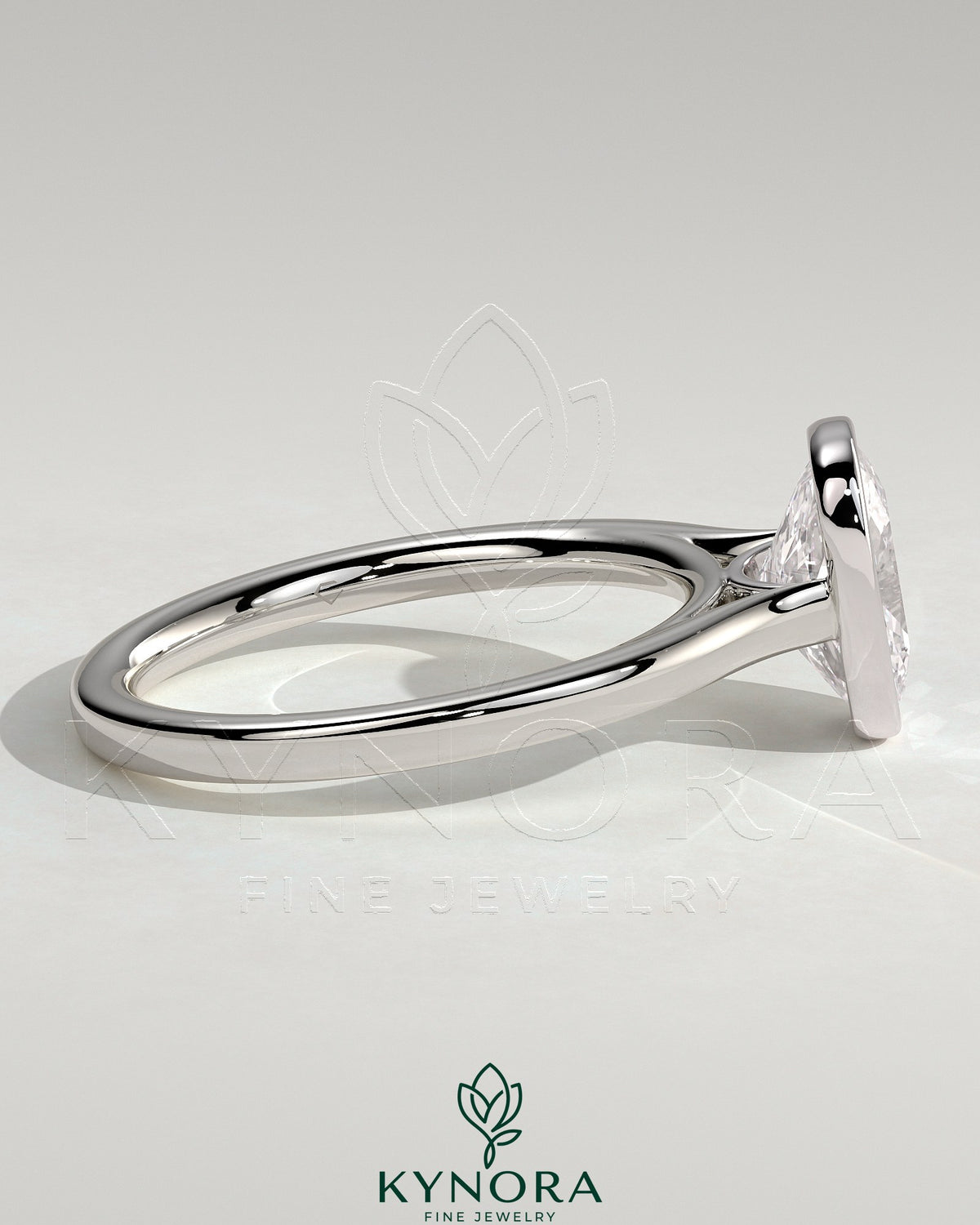 Kynora CJ 2ct elongated cushion bezel solitaire engagement ring with cathedral high setting, showcasing a sparkling diamond and elegant band.