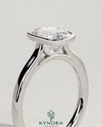 Kynora CJ 2ct elongated cushion bezel solitaire engagement ring with cathedral high setting, featuring a sparkling diamond and elegant design.