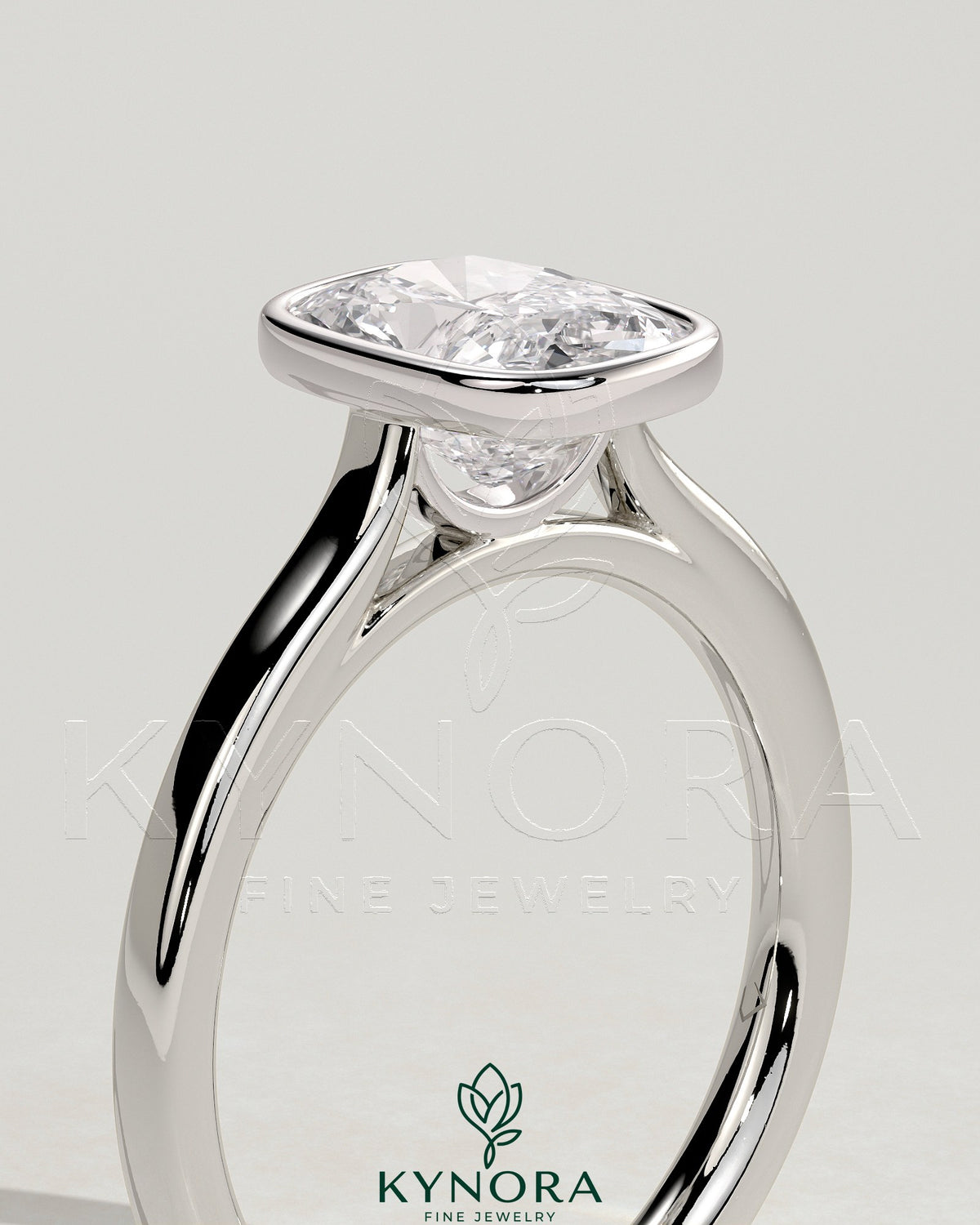 Kynora CJ 2ct elongated cushion bezel solitaire engagement ring with cathedral high setting, featuring a sparkling diamond and elegant design.