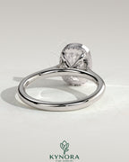 Kynora CJ 2ct elongated cushion bezel solitaire engagement ring with hidden halo and cathedral high setting, showcasing intricate design.