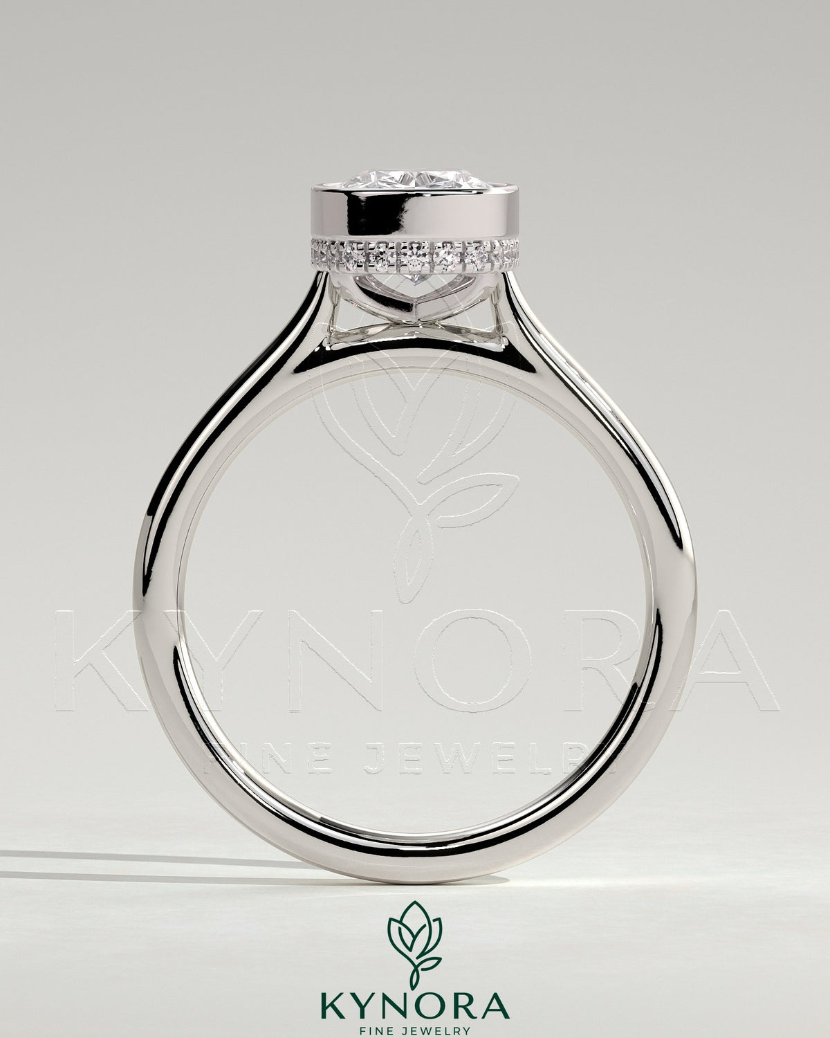 Kynora CJ 2ct elongated cushion bezel solitaire engagement ring with hidden halo and cathedral high setting, silver band.