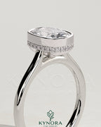Kynora CJ 2ct elongated cushion bezel solitaire engagement ring with hidden halo and cathedral high setting, showcasing intricate design.