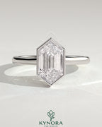 Kynora CJ 2ct elongated hexagon bezel solitaire engagement ring with hidden halo and cathedral high setting, showcasing intricate design.