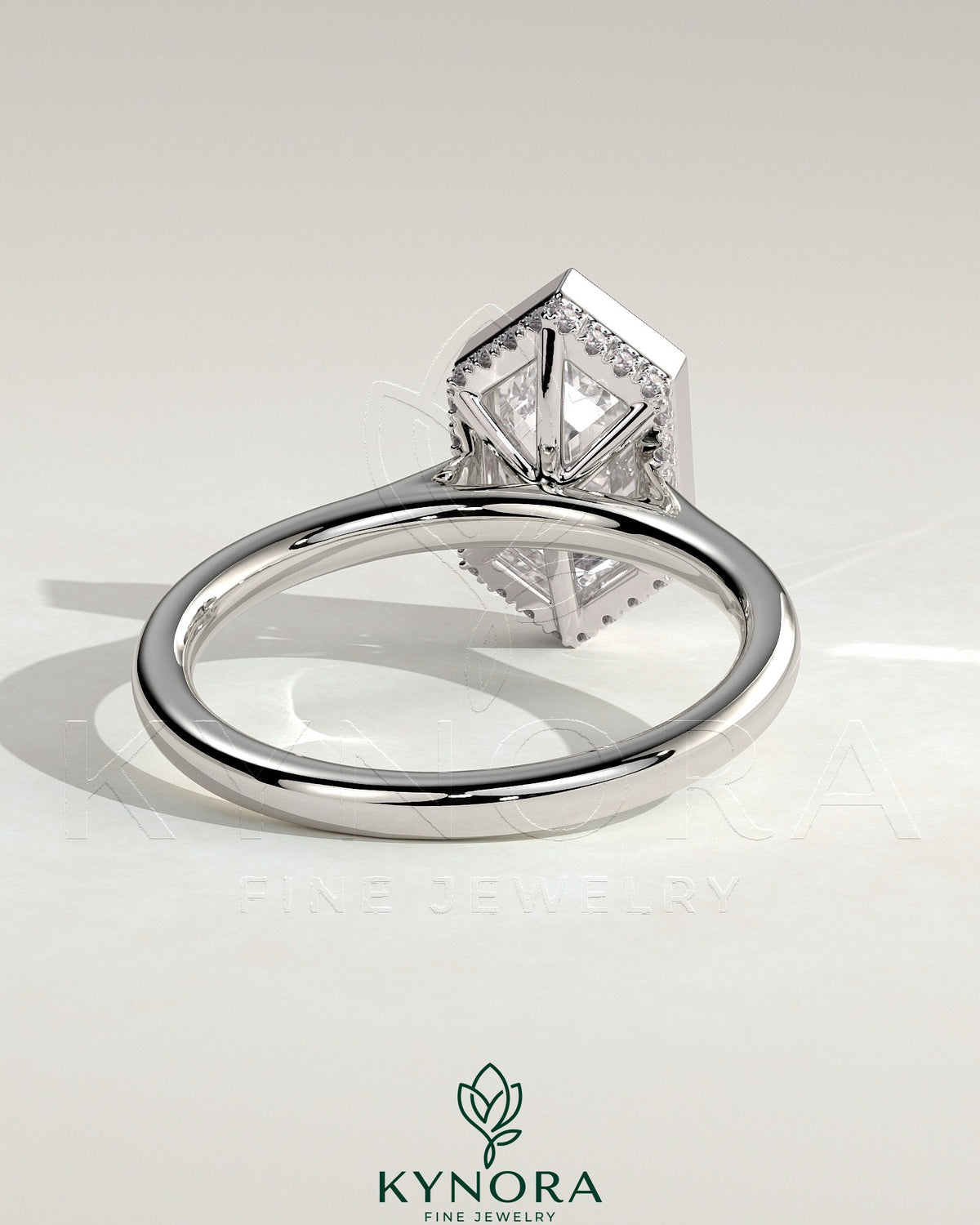 Kynora CJ 2ct elongated hexagon bezel solitaire engagement ring with hidden halo and cathedral high setting, showcasing intricate design.