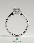 Kynora CJ 2ct emerald bezel solitaire engagement ring with hidden halo and cathedral high setting, showcasing intricate craftsmanship.