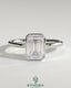 Kynora CJ 2ct emerald bezel solitaire engagement ring with petal gallery design, showcasing a central emerald-cut stone in a detailed setting.